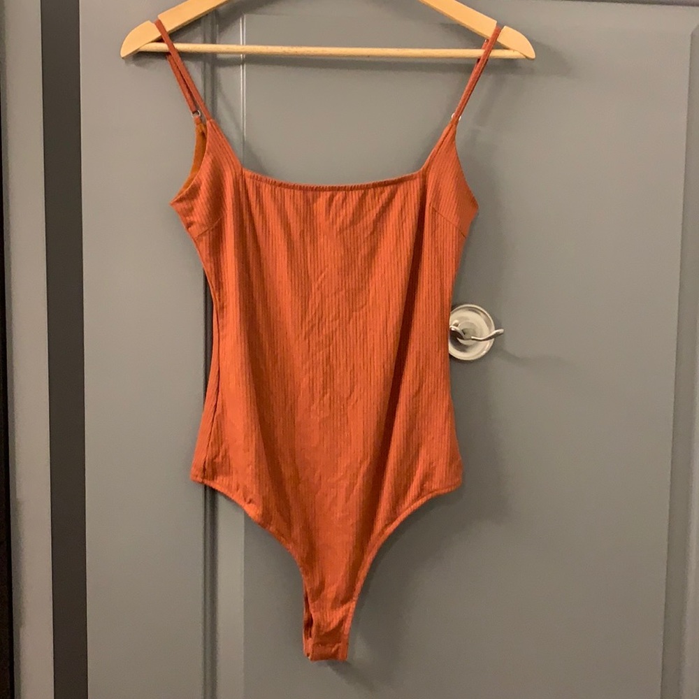 Lulu’s orange bodysuit